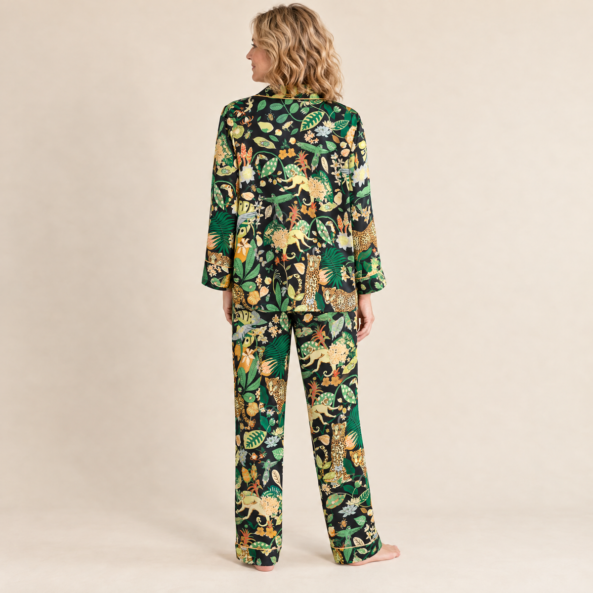 Back view of the Black Jungle Leopard satin pyjama set, long-sleeved top and full-length trousers in a black jungle leopard print