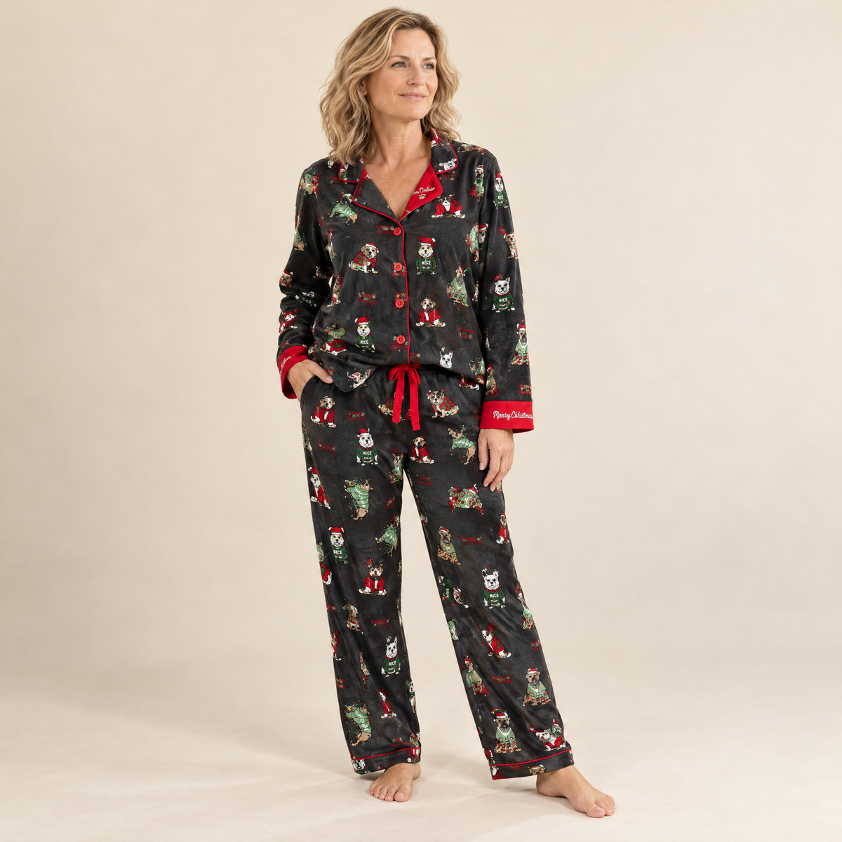 Woman wearing black Christmas dog print cotton flannel pyjamas with contrast piping, front view