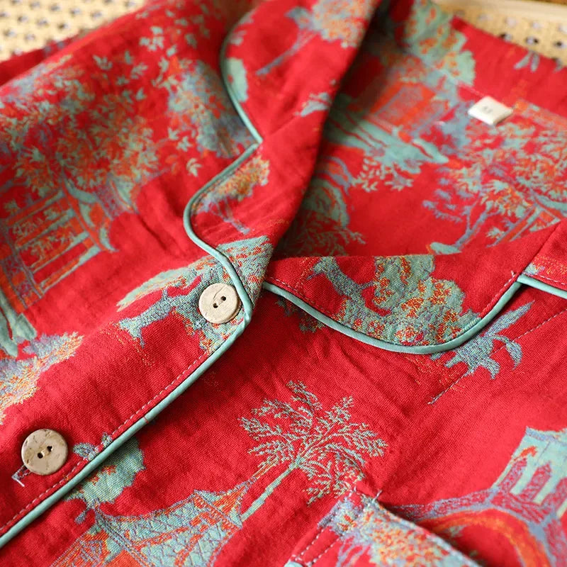 Oriental Bloom cotton pyjamas in Fire Red, close-up of the teal toile print and wooden buttons