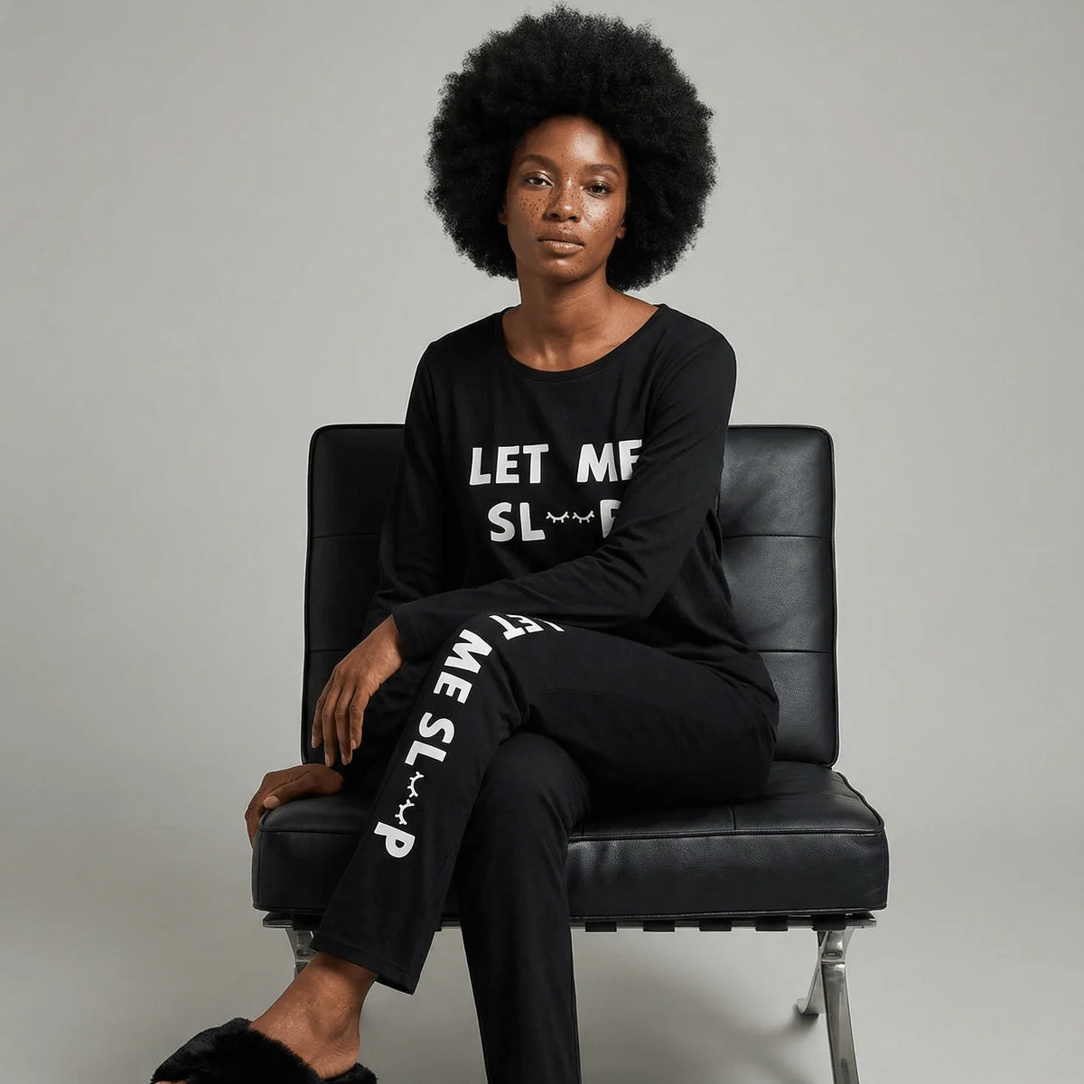 Woman wearing Night Owl Pyjamas black 'Let Me Sleep' lightweight pyjama set