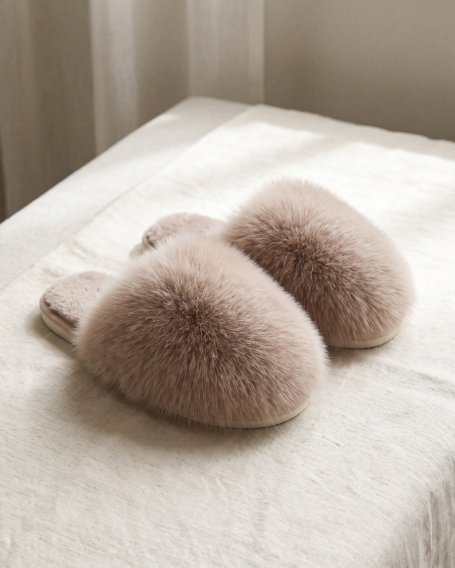 Closed-toe faux fur pom pom slippers in beige