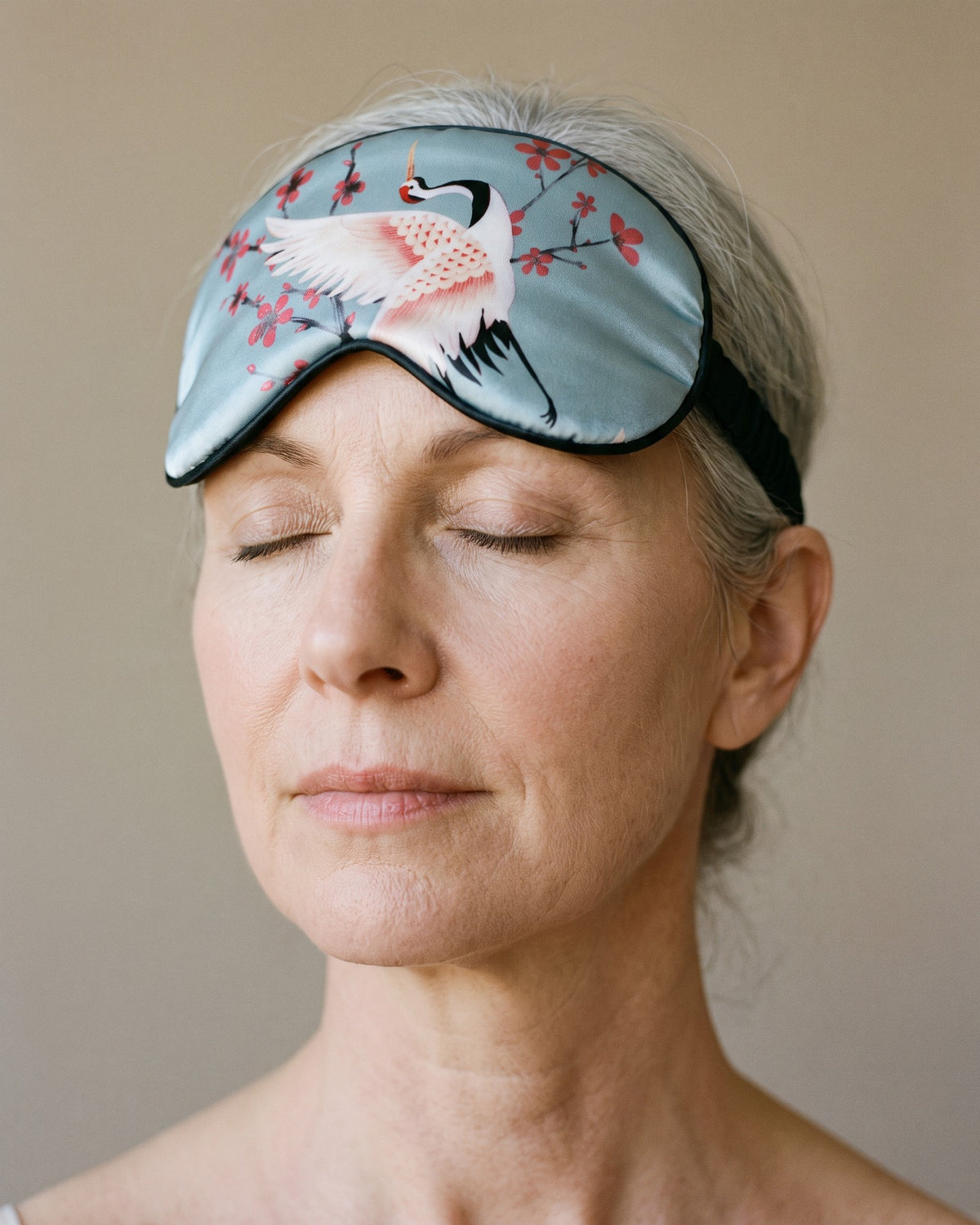 The Sakura Satin Eye Mask, worn